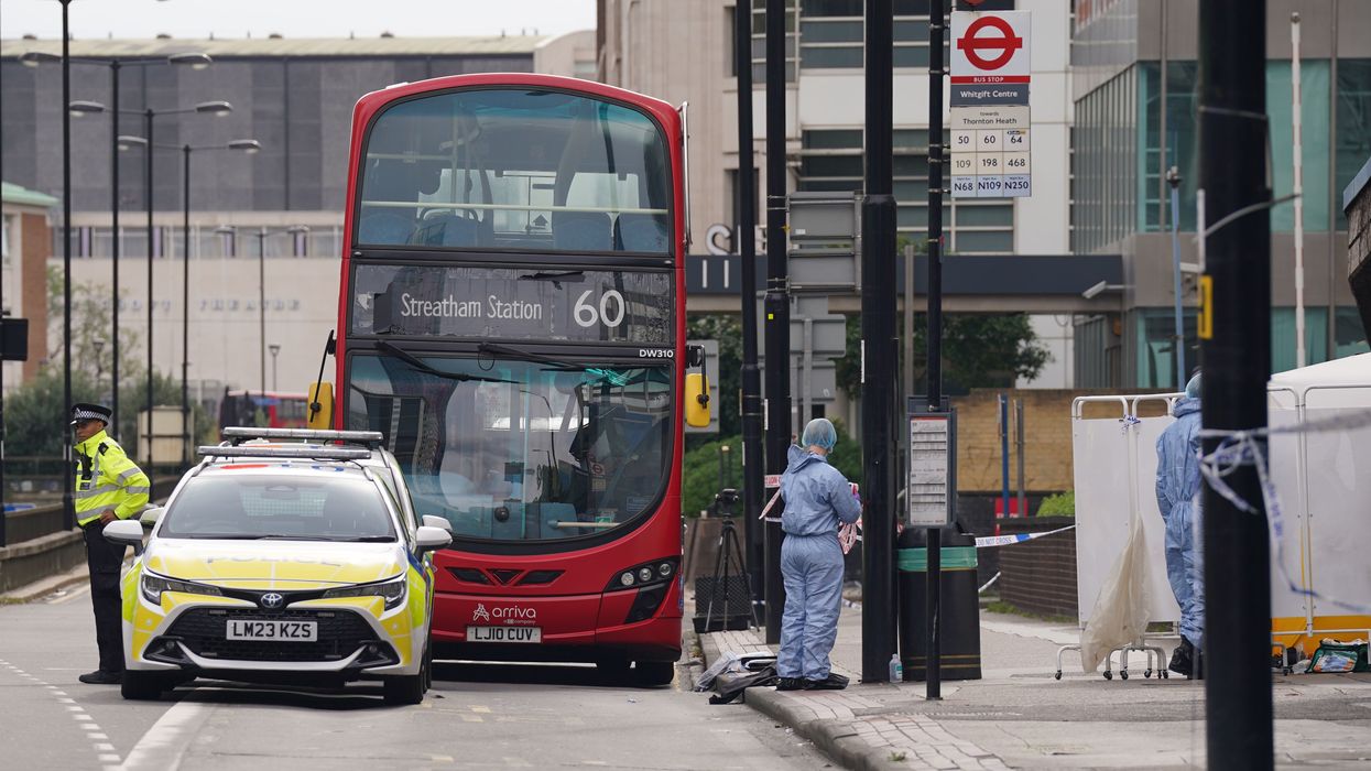 Forensic investigators at the scene near the Whitgift shopping centre in Croydon, south London after a 15-year-old girl was stabbed to death on Wednesday morning