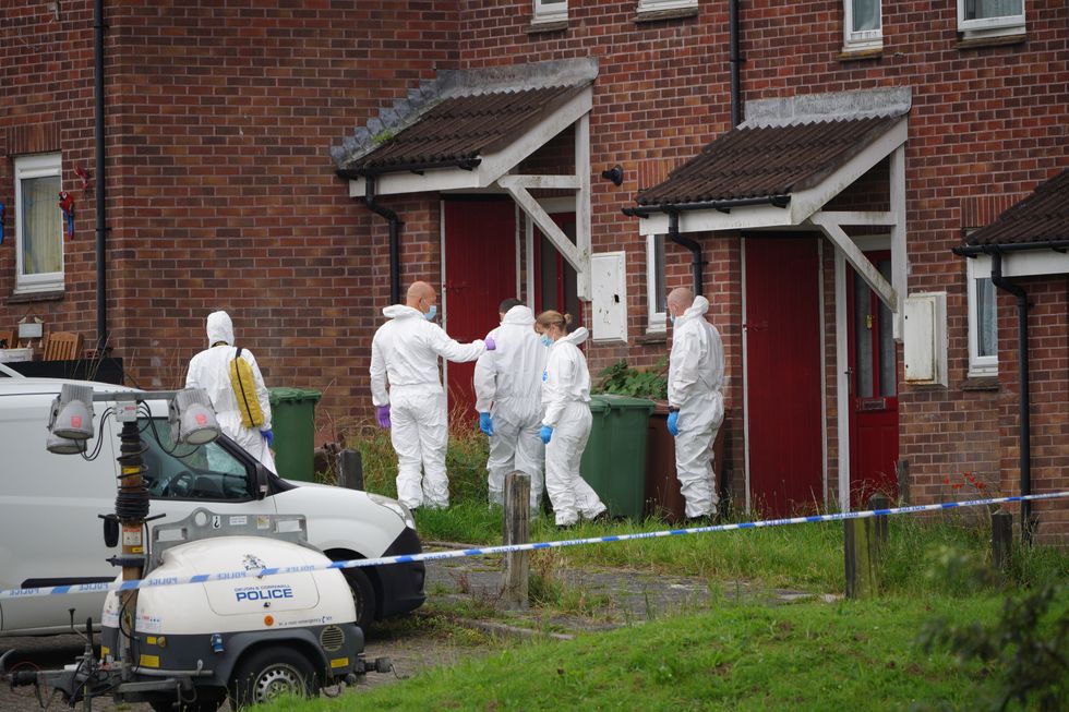 Forensic officers in Biddick Drive in the Keyham area of Plymouth where six people, including the offender, died of gunshot wounds in a firearms incident Thursday evening. Picture date: Friday August 13, 2021.