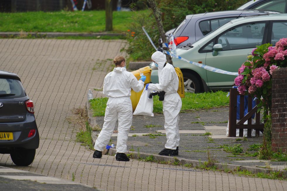 Forensic officers in Biddick Drive in the Keyham area of Plymouth where six people, including the offender, died of gunshot wounds in a firearms incident Thursday evening. Picture date: Friday August 13, 2021.
