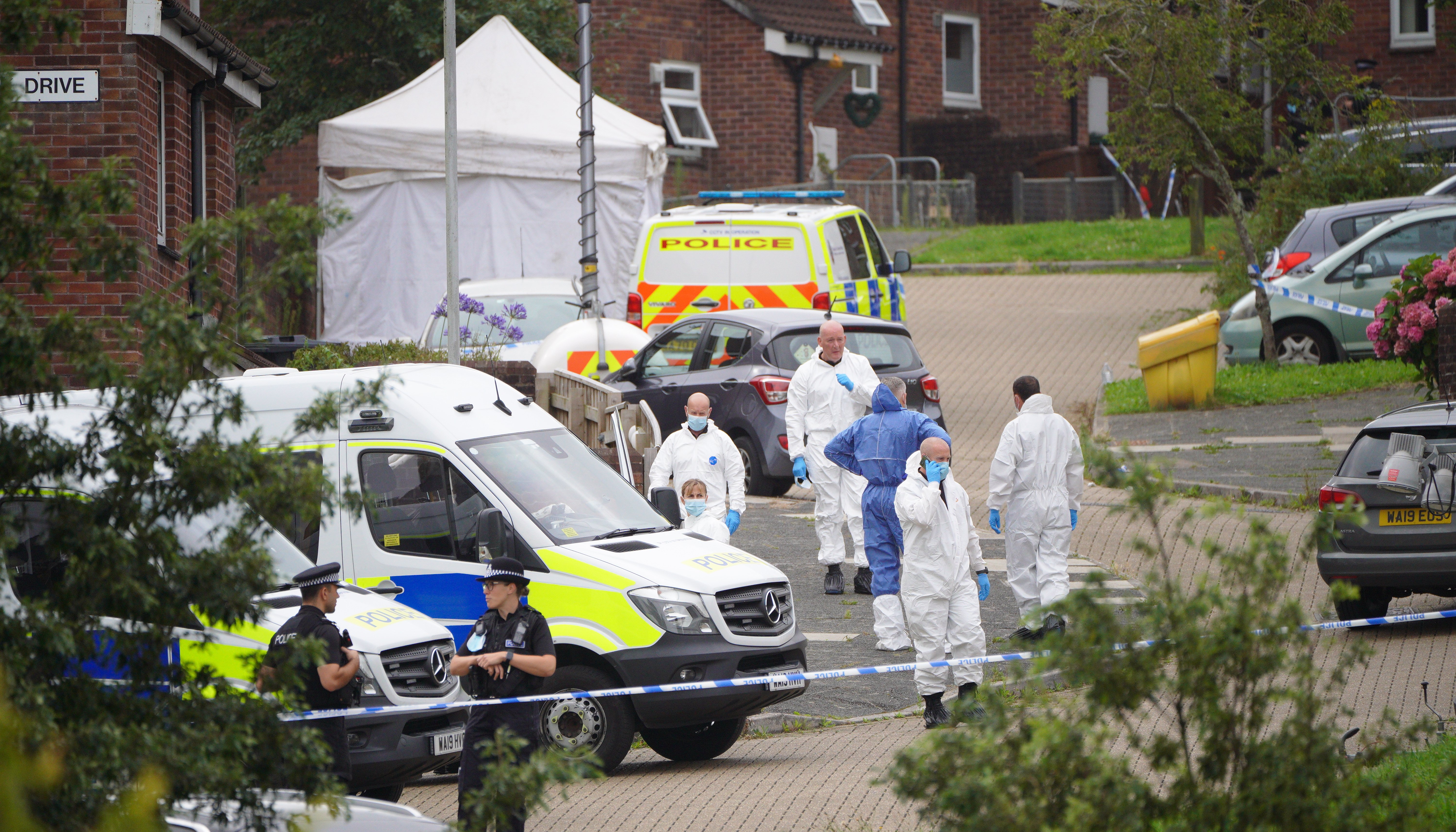 Forensic officers in Biddick Drive in the Keyham area of Plymouth where six people, including the offender, died of gunshot wounds in a firearms incident Thursday evening.