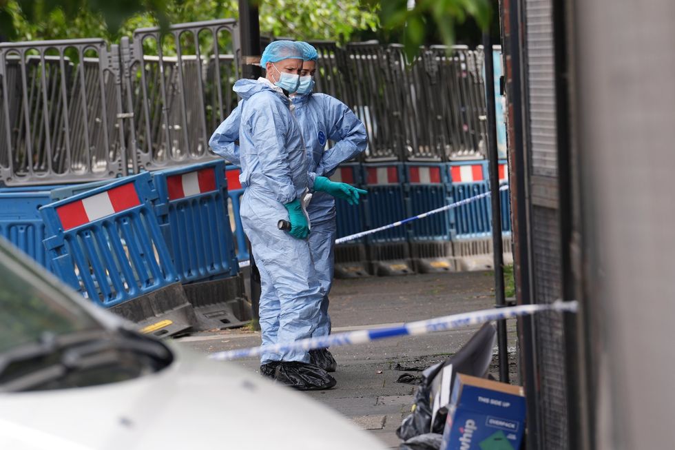 Forensic officers on scene of Nelson Street after suspected arson attack