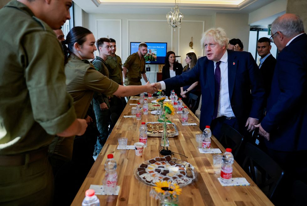 Former British Prime Minister Boris Johnson and former Australian Prime Minister Scott Morrison meet with British-Israeli soldiers during a visit to Jerusalem