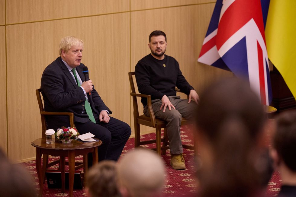 Former British Prime Minister Boris Johnson and Ukraine's President Volodymyr Zelenskiy address students of the State Taras Shevchenko University, amid Russia's attack on Ukraine, in Kyiv, Ukraine January 22, 2023.  Ukrainian Presidential Press Service/Handout via REUTERS ATTENTION EDITORS - THIS IMAGE HAS BEEN SUPPLIED BY A THIRD PARTY.