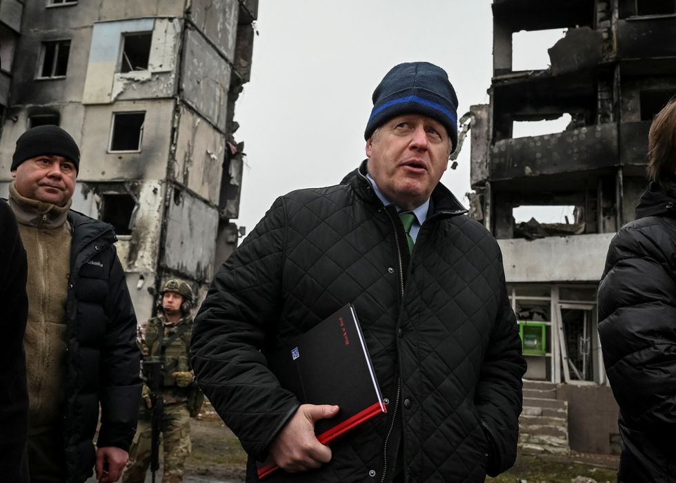 Former British Prime Minister Boris Johnson visits the town of Borodianka, heavily damaged during Russia's invasion of Ukraine, outside of Kyiv, Ukraine January 22, 2023. REUTERS/Viacheslav Ratynskyi