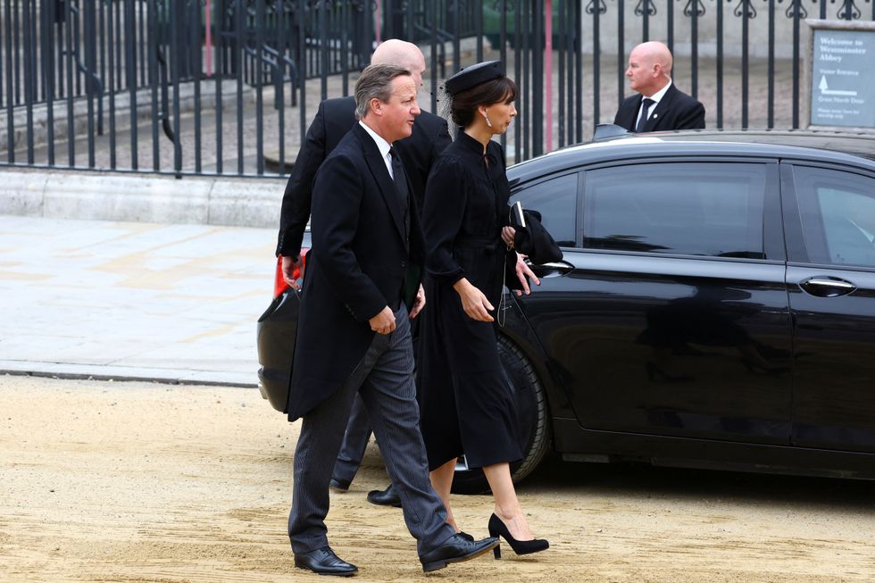 Former British Prime Minister David Cameron and his wife Samantha walk outside the Westminster Abbey, on the day of the state funeral and burial of Britain's Queen Elizabeth, in London, Britain, September 19, 2022. REUTERS/Hannah McKay/Pool