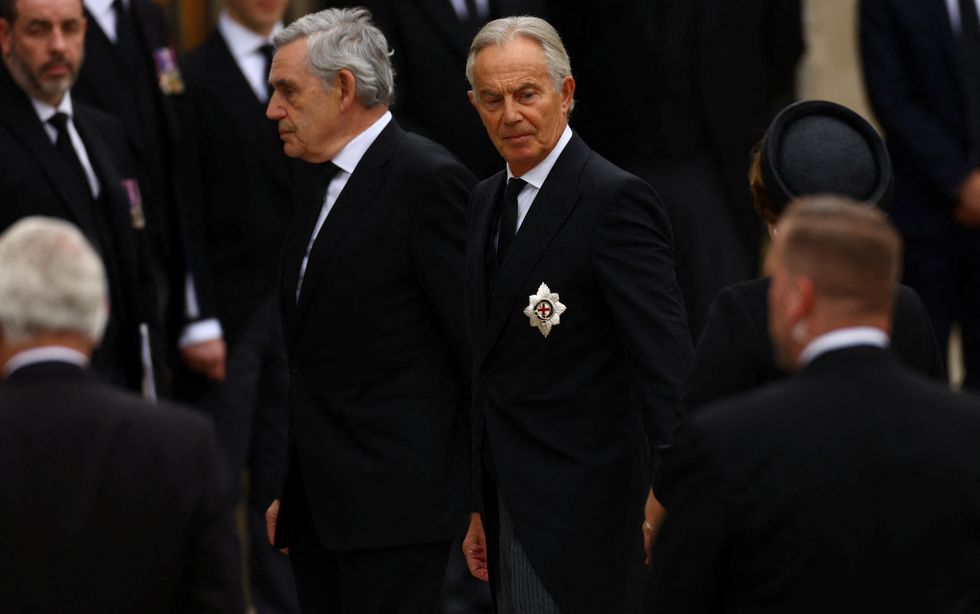 Former British prime ministers Gordon Brown and Tony Blair arrive at Westminster Abbey on the day of the state funeral and burial of Britain's Queen Elizabeth, in London, Britain, September 19, 2022. REUTERS/Kai Pfaffenbach