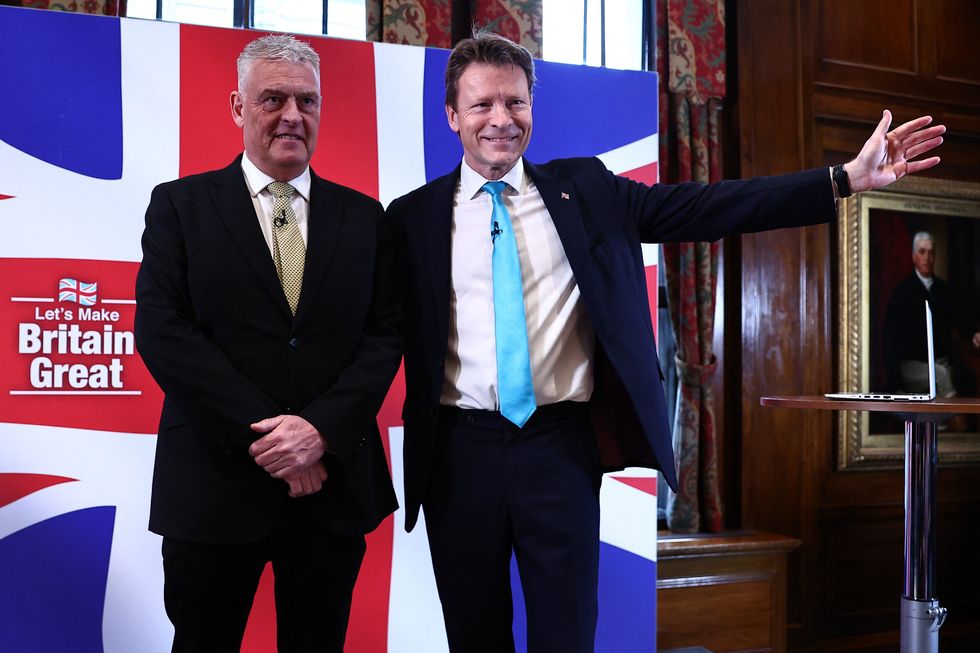 Former Conservative deputy chairman Lee Anderson (L) poses for pictures with Leader of Reform UK party Richard Tice (R) following a press conference to announce his defection