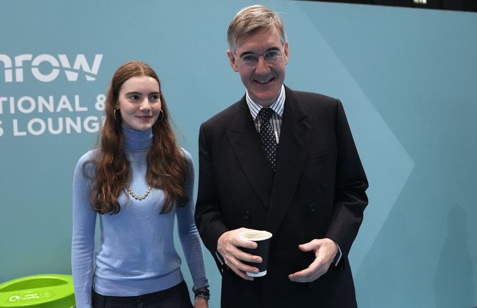 Former Conservative MP Jacob Rees-Mogg and his daughter Mary during the party's annual conference at the National Exhibition Centre in Birmingham.