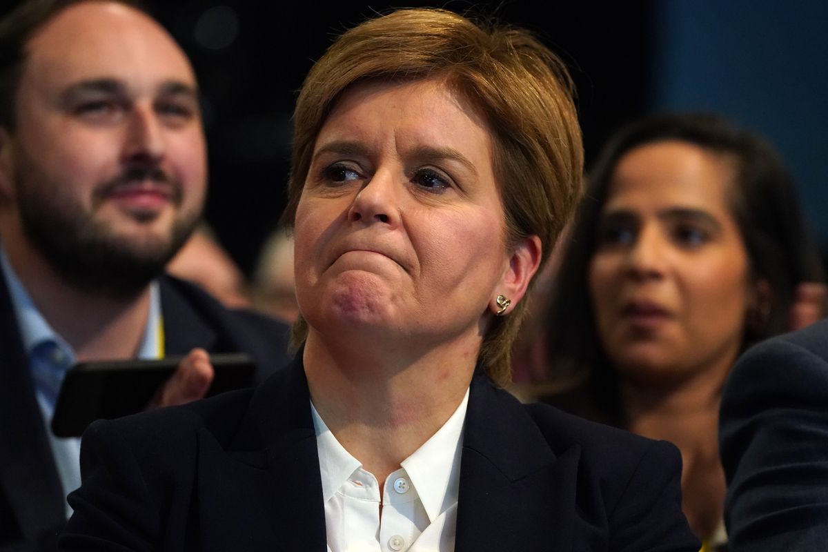 Former leader Nicola Sturgeon in the conference hall as tributes to her are played on a screen to delegates at the SNP annual conference