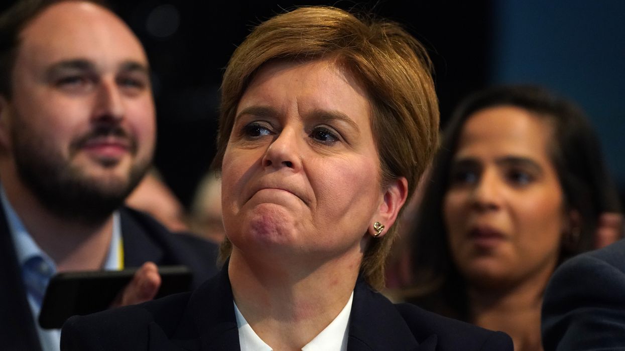 Former leader Nicola Sturgeon in the conference hall as tributes to her are played on a screen to delegates at the SNP annual conference