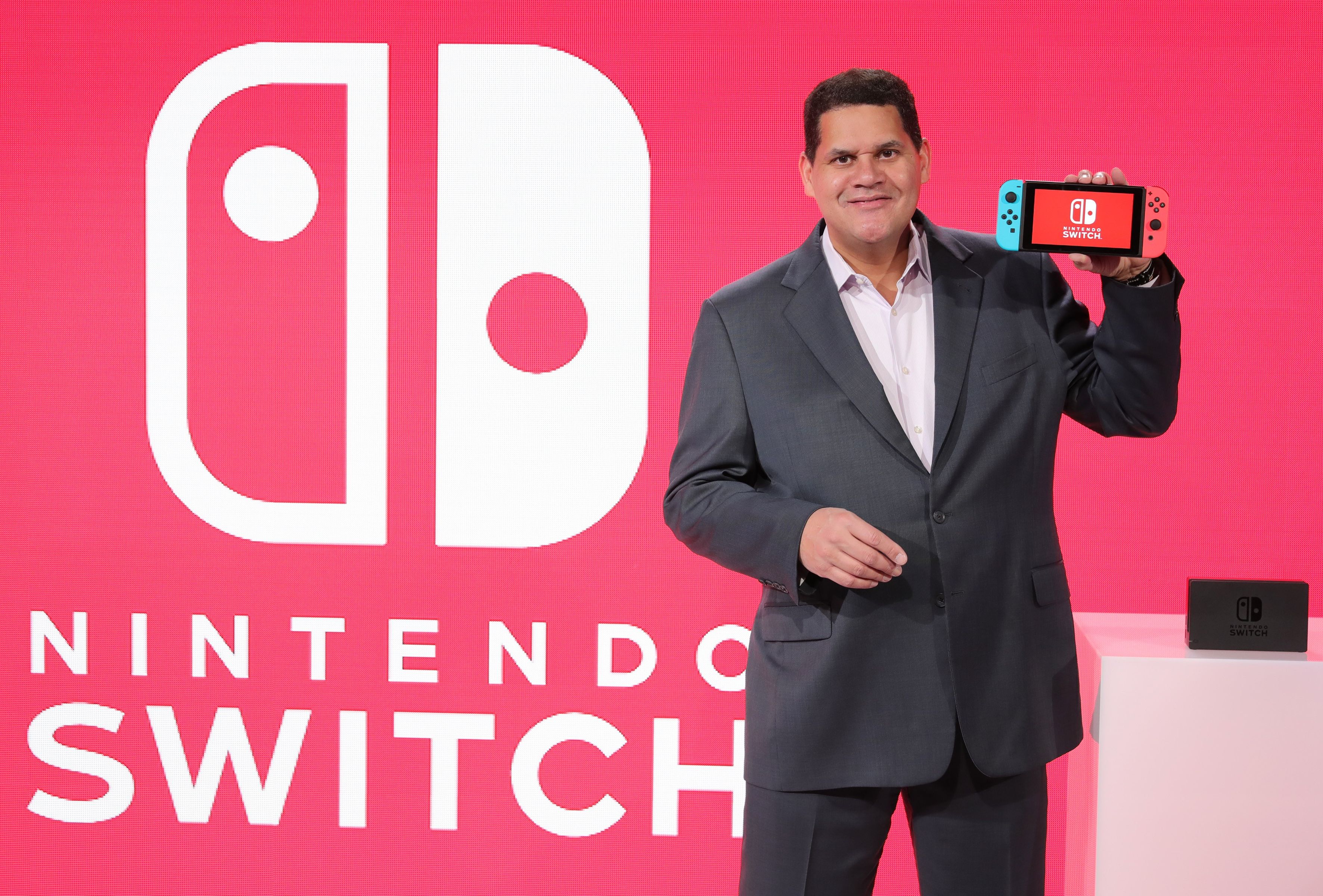 Former Nintendo of America President Reggie Fils-Aim\u00e9 on-stage with the Nintendo Switch