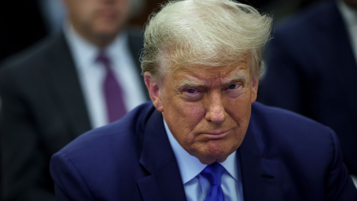 Former President Donald Trump sits in court during his civil fraud trial at New York State Supreme Court