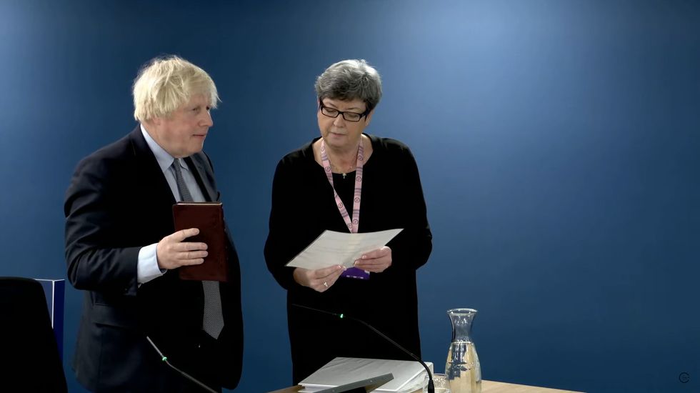 Former prime minister Boris Johnson being sworn in ahead of giving evidence at Dorland House in London