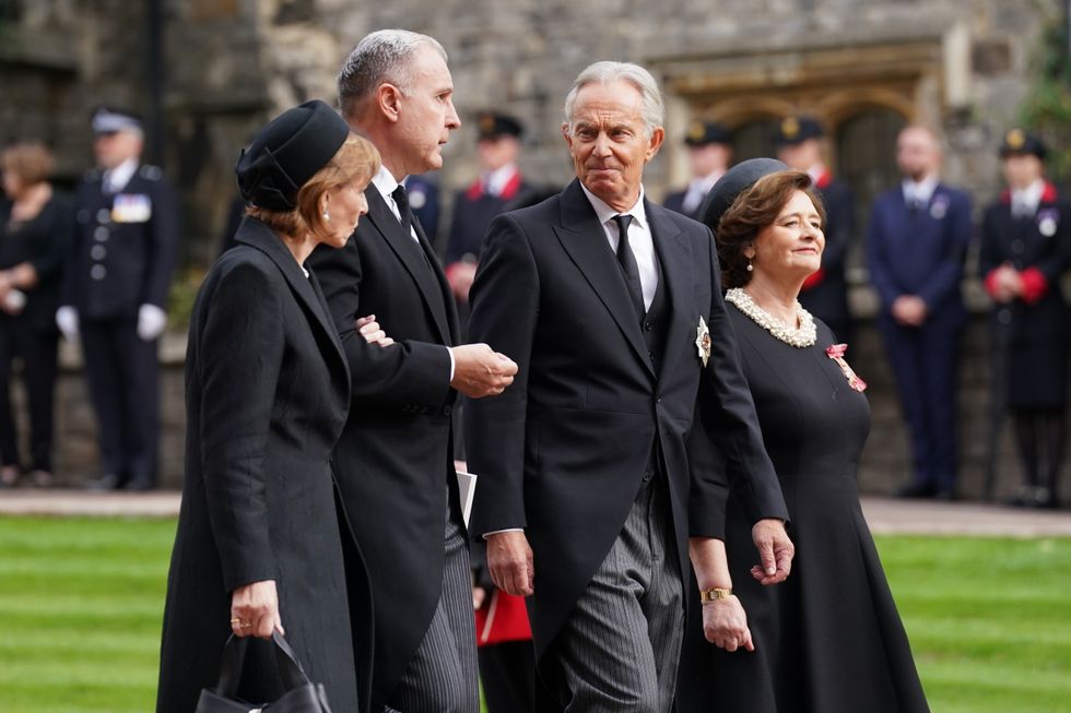 Former Prime Minister Sir Tony Blair (centre right) and wife Cherie arrive for the Committal Service for Queen Elizabeth II held at St George's Chapel in Windsor Castle, Berkshire. Picture date: Monday September 19, 2022.
