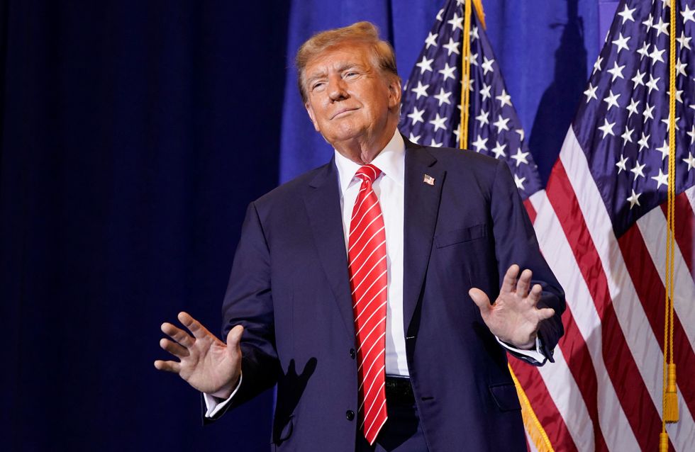 Former U.S. President and Republican presidential candidate Donald Trump gestures during a rally ahead of the New Hampshire primary election in Concord