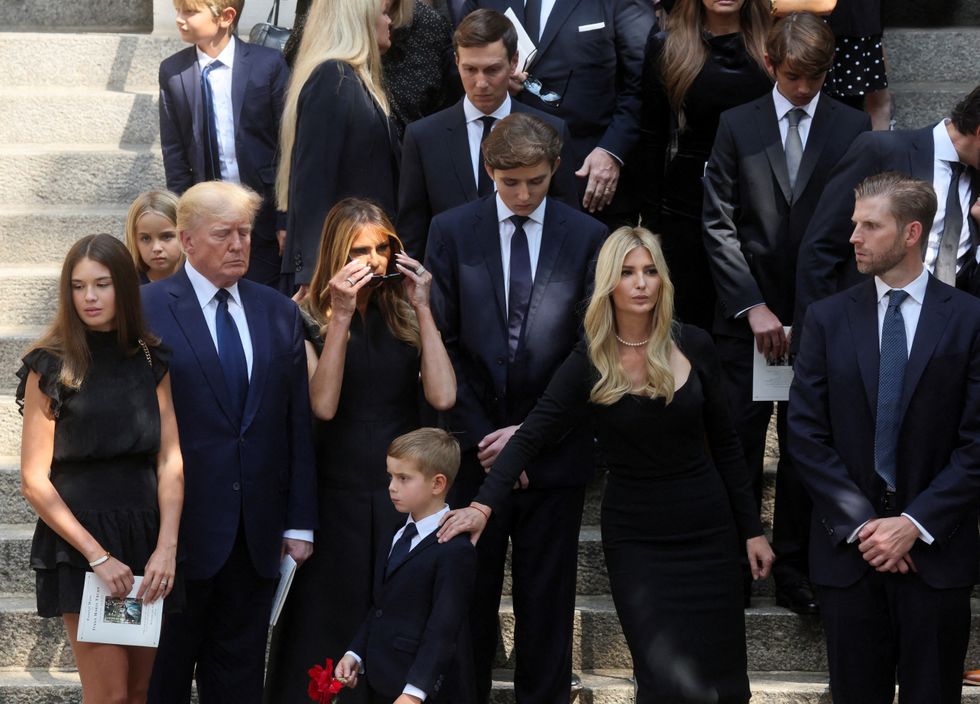 Former U.S. President Donald Trump, his wife Melania, his sons Barron and Eric, his daughter Ivanka, her husband Jared Kushner and his granddaughter Kai Madison leave St. Vincent Ferrer Church during the funeral of Ivana Trump, socialite and Trump's first wife, in New York City, U.S., July 20, 2022. REUTERS/Brendan McDermid