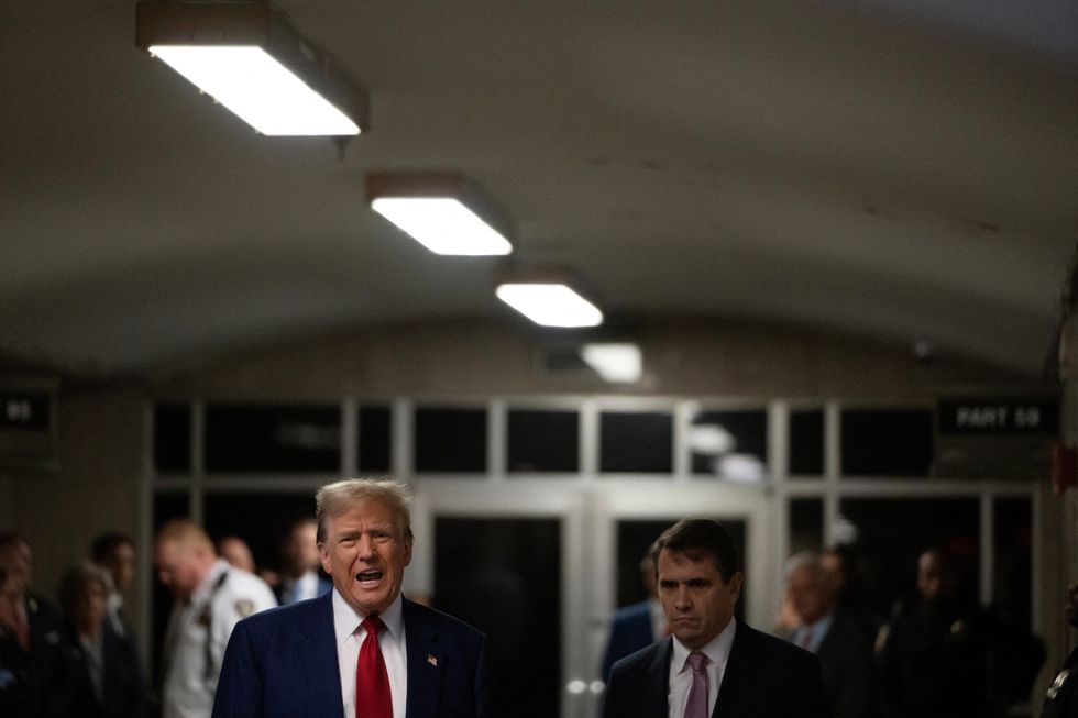 Former U.S. President Donald Trump walks at Manhattan criminal court