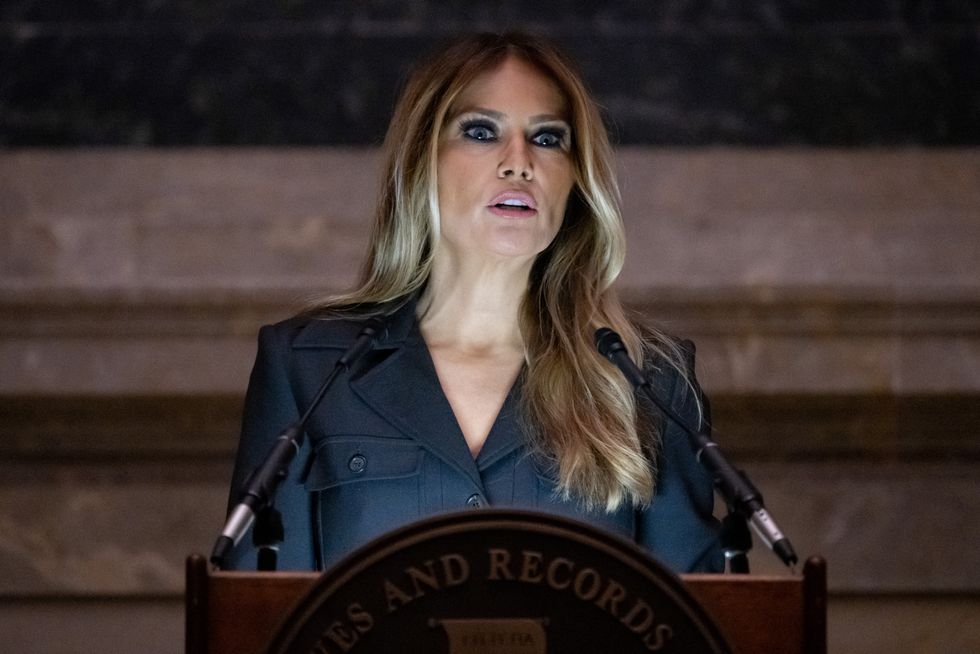 Former US First Lady Melania Trump speaks during a Naturalization Ceremony at the National Archives building