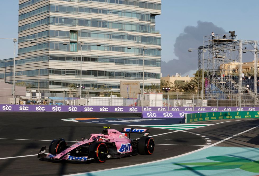 Formula One F1 - Saudi Arabia Grand Prix - Jeddah Corniche Circuit, Jeddah, Saudi Arabia - March 25, 2022 Alpine's Esteban Ocon during practice as smoke is seen in the background REUTERS/Hamad I Mohammed