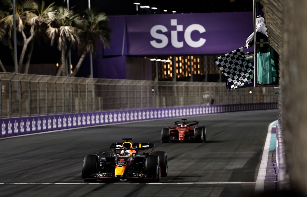 Formula One F1 - Saudi Arabia Grand Prix - Jeddah Corniche Circuit, Jeddah, Saudi Arabia - March 27, 2022 Red Bull's Max Verstappen crosses the line to win the race ahead of Ferrari's Charles Leclerc REUTERS/Hamad I Mohammed/Pool