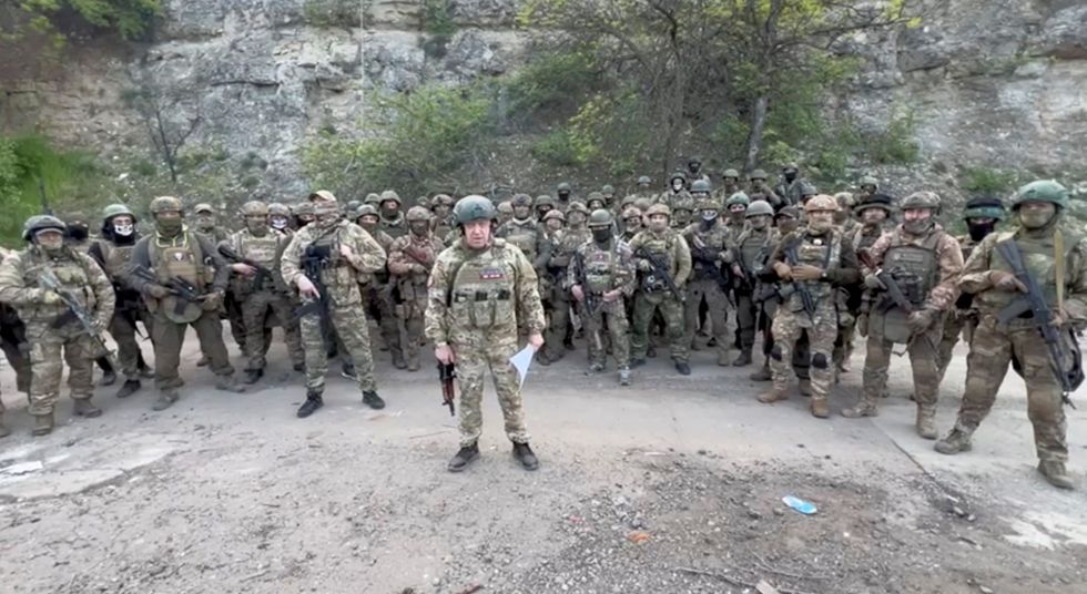 Founder of Wagner private mercenary group Yevgeny Prigozhin ranting surrounded by his fighters