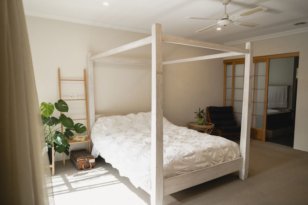 Four poster bed in neutral bedroom