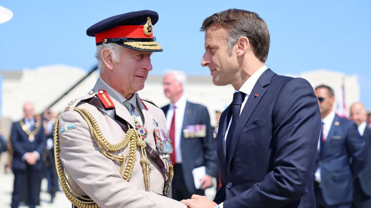 France's President Emmanuel Macron greets Britain's King Charles III