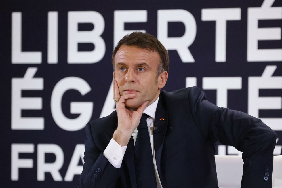 France's President Emmanuel Macron reacts during a press conference