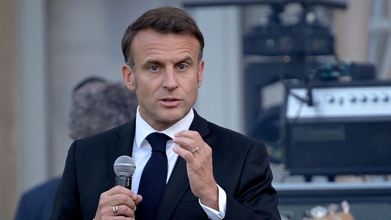 France's President Emmanuel Macron speaks during the annual "Fete de la musique" one-day music festival in the courtyard of the Elysee presidential palace in Paris