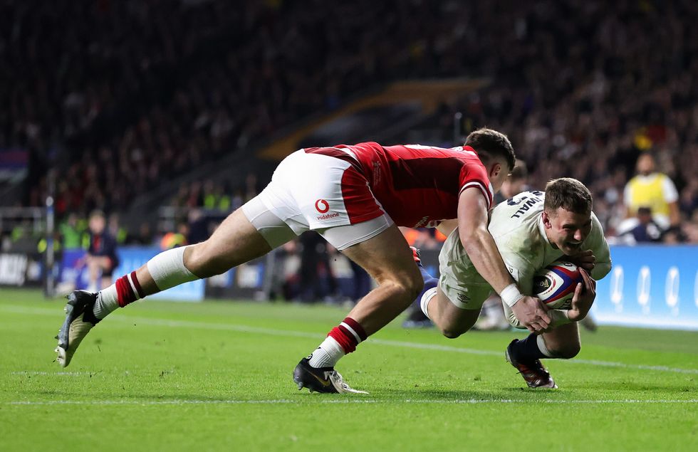 Fraser Dingwall of England scores his team's second try as Mason Grady of Wales attempts to tackle him during the Guinness Six Nations 2024