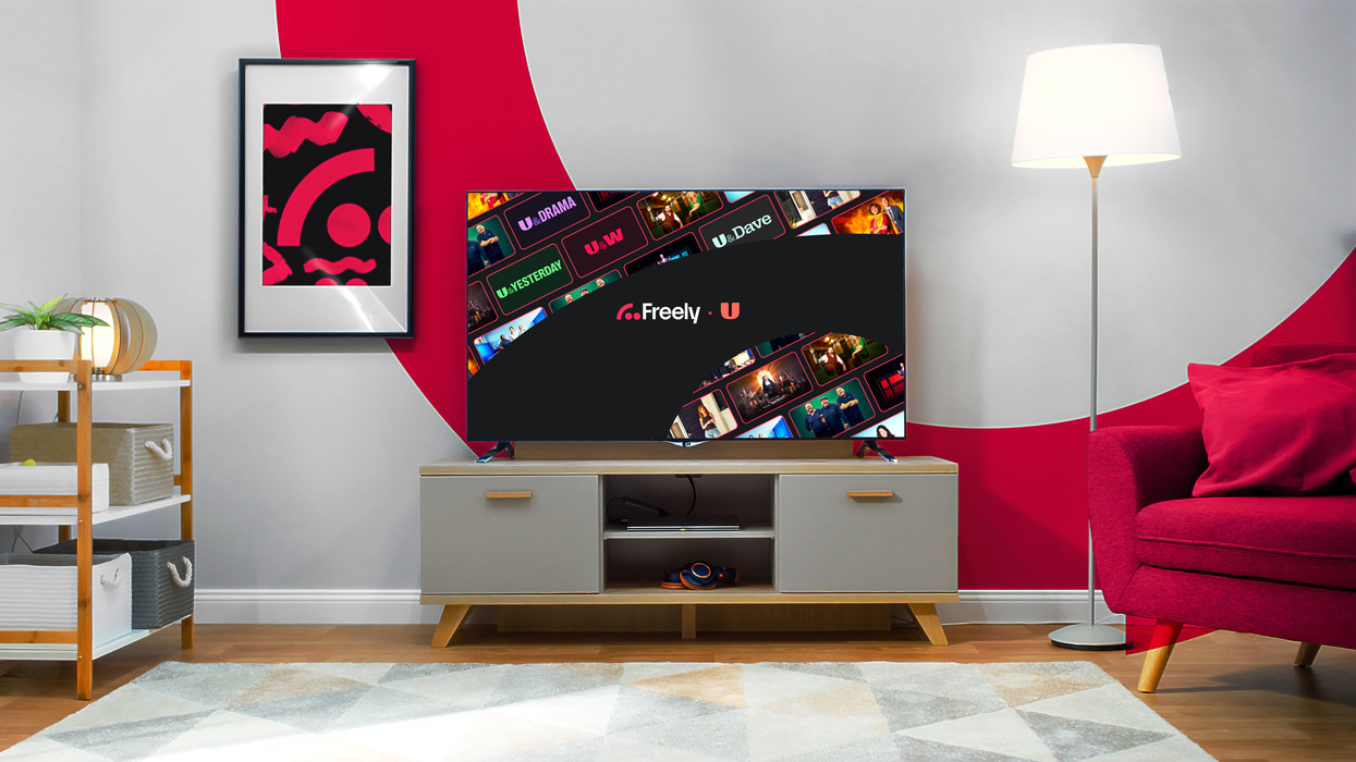 freely logo on a television in a living room