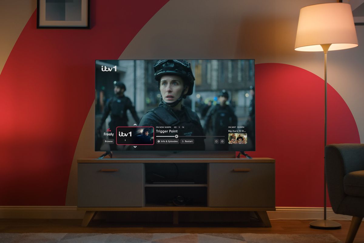 Freely TV on the Mini Guide interface pictures on-screen with the Freely logo in the background