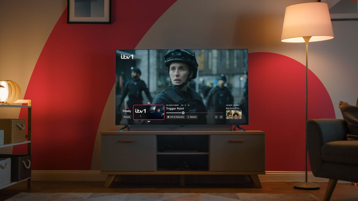 Freely TV on the Mini Guide interface pictures on-screen with the Freely logo in the background
