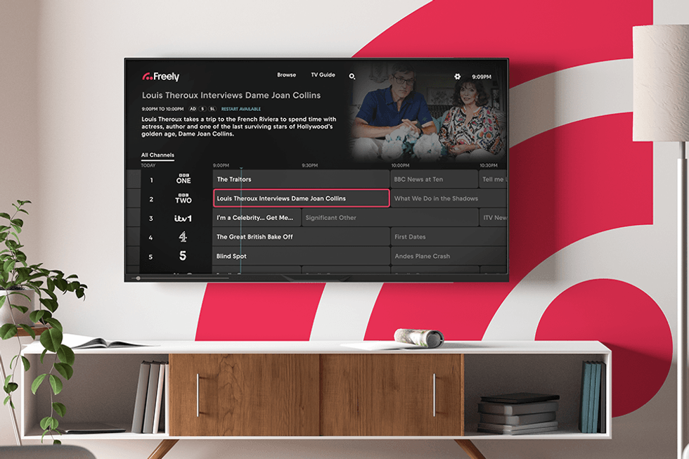 freely tv shown on a flatscreen on a wall with the freely logo in the background