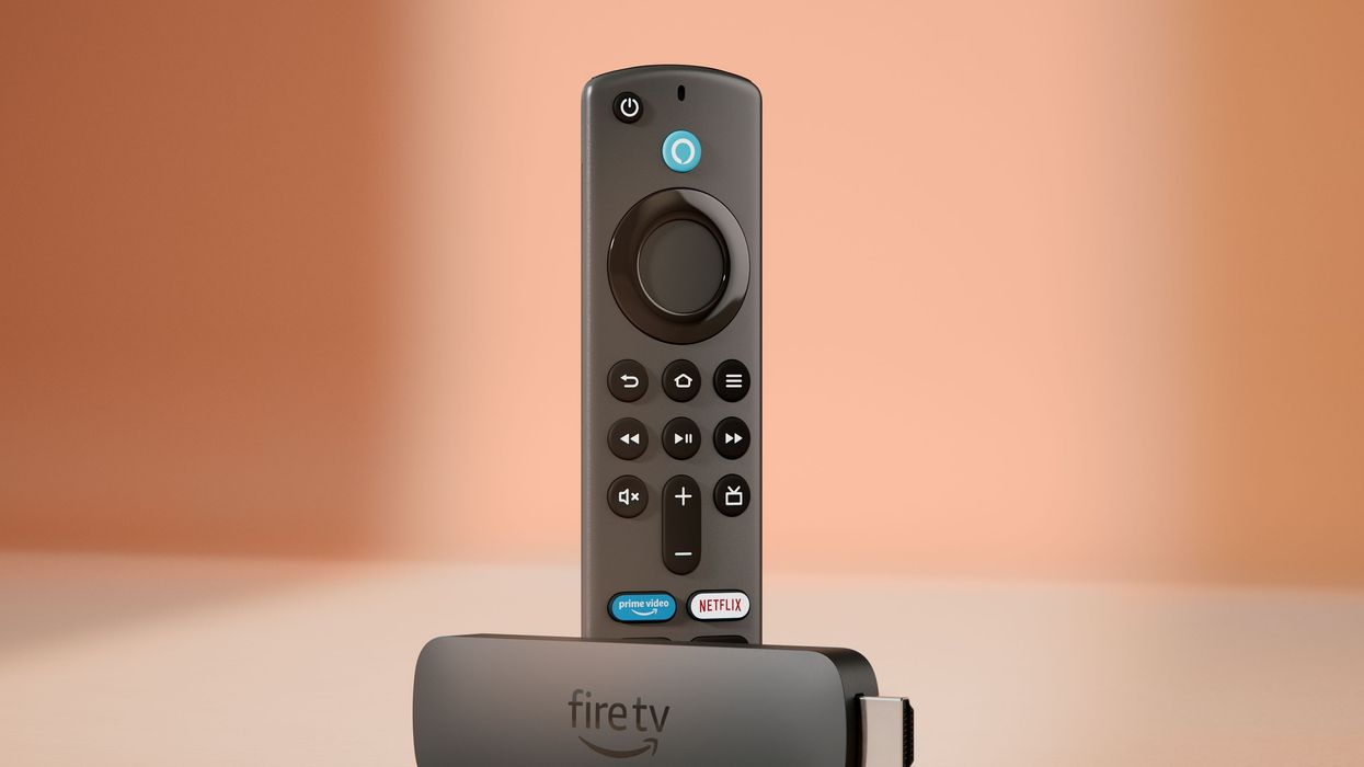 freestanding fire tv stick pictured standing with a bronze background