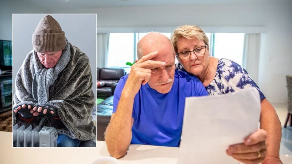 Freezing man and couple looking at a bill