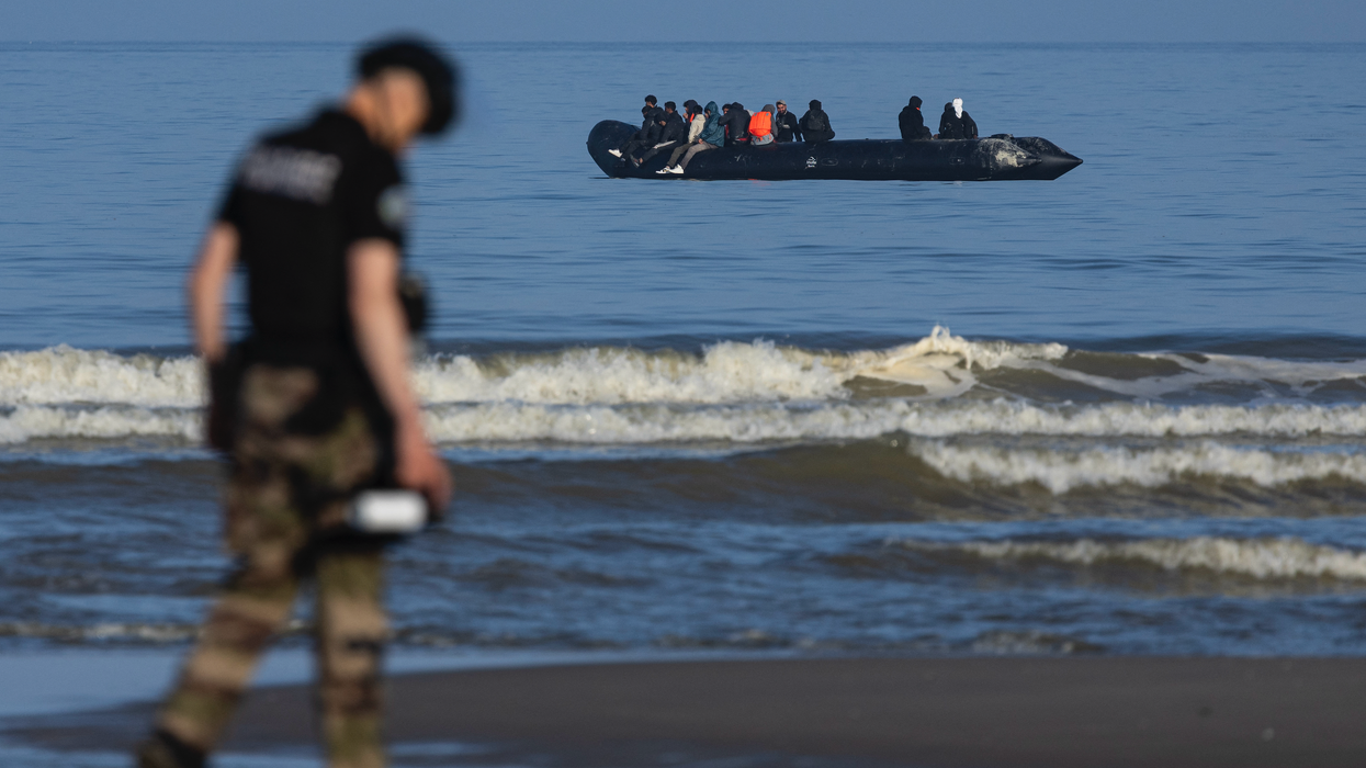 French border patrol monitor shore as migrant boat approaches