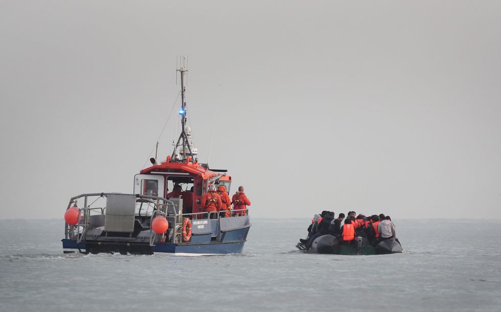 French maritime vessel picking up migrant boat