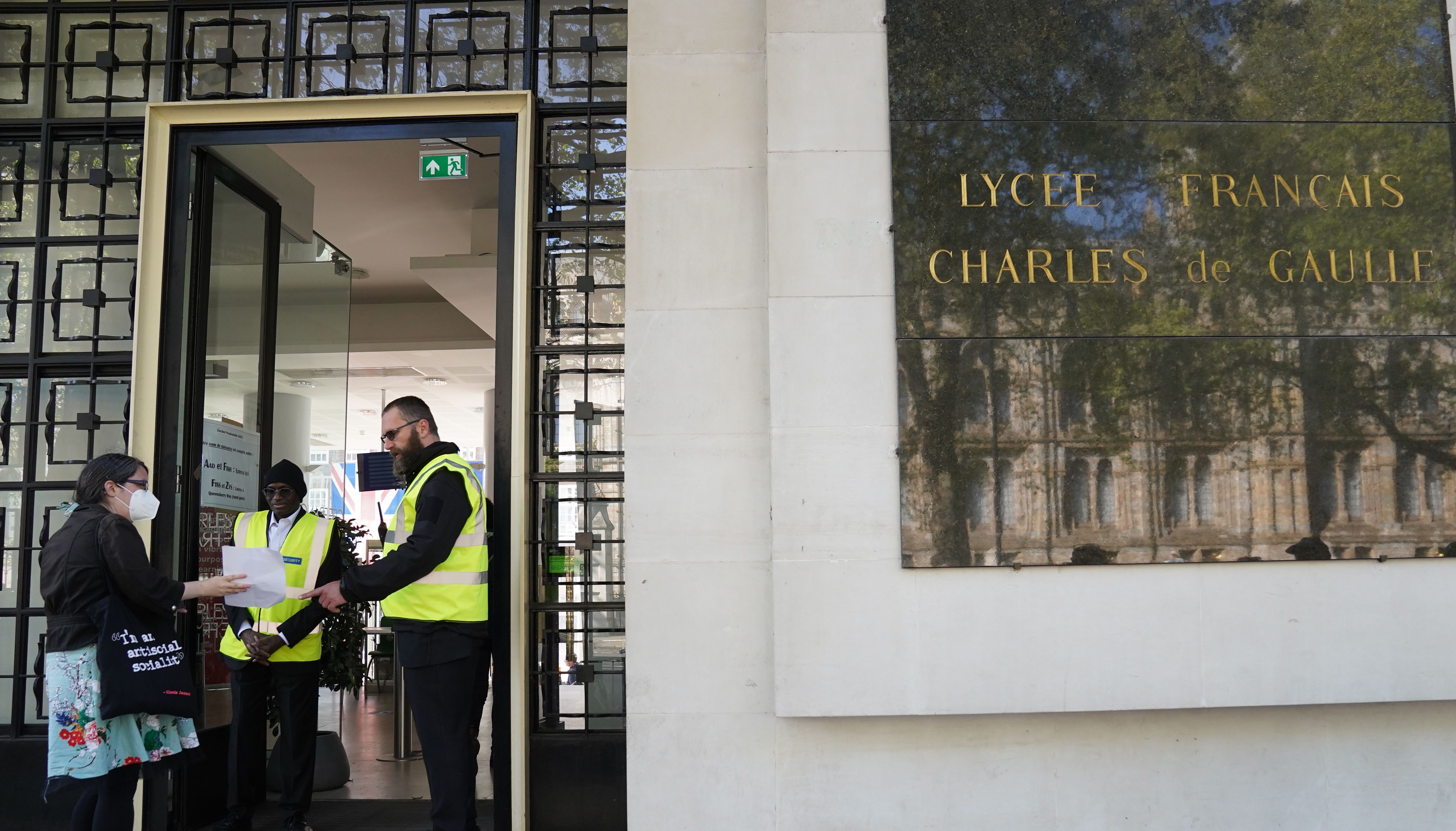 French nationals arrive to vote at Lycee Francais Charles de Gaulle in London, for the French presidential election between Emmanuel Macron and Marine Le Pen. Picture date: Sunday April 24, 2022.
