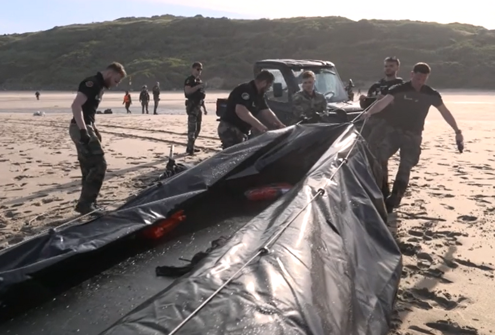 French police alongside the inflatable vessel