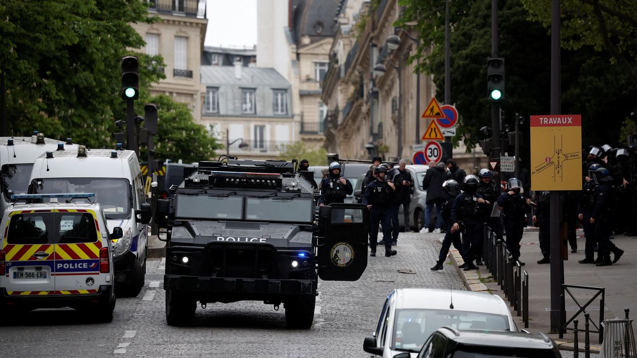 French police and members of French special police forces of Research and Intervention Brigade (BRI) secure the area near Iran consulate where a man is threatening to blow himself up