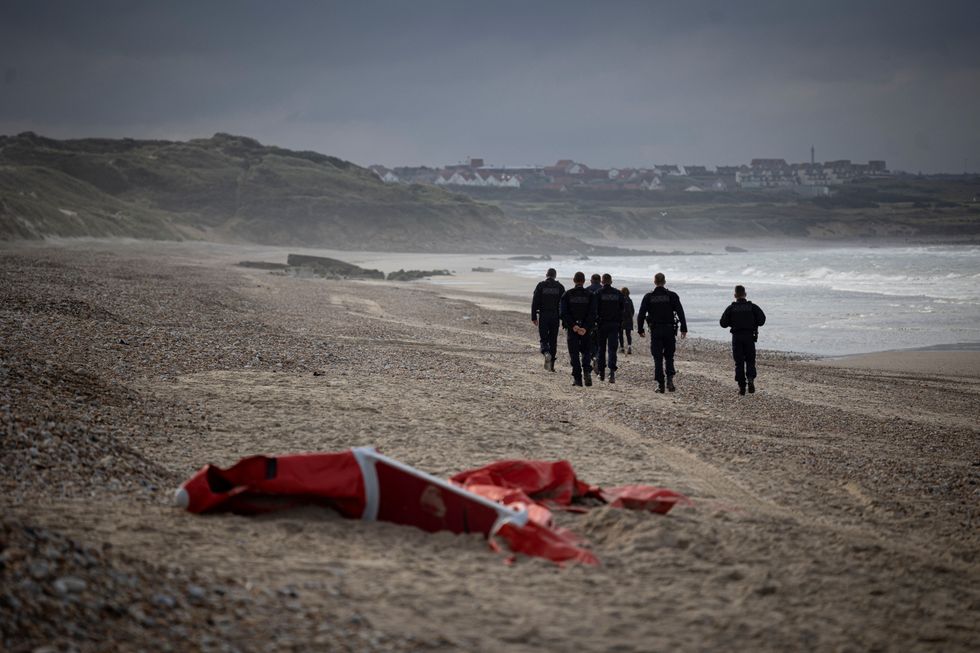 French police officers patrolling the beach between Ambleteusse and Wimereux