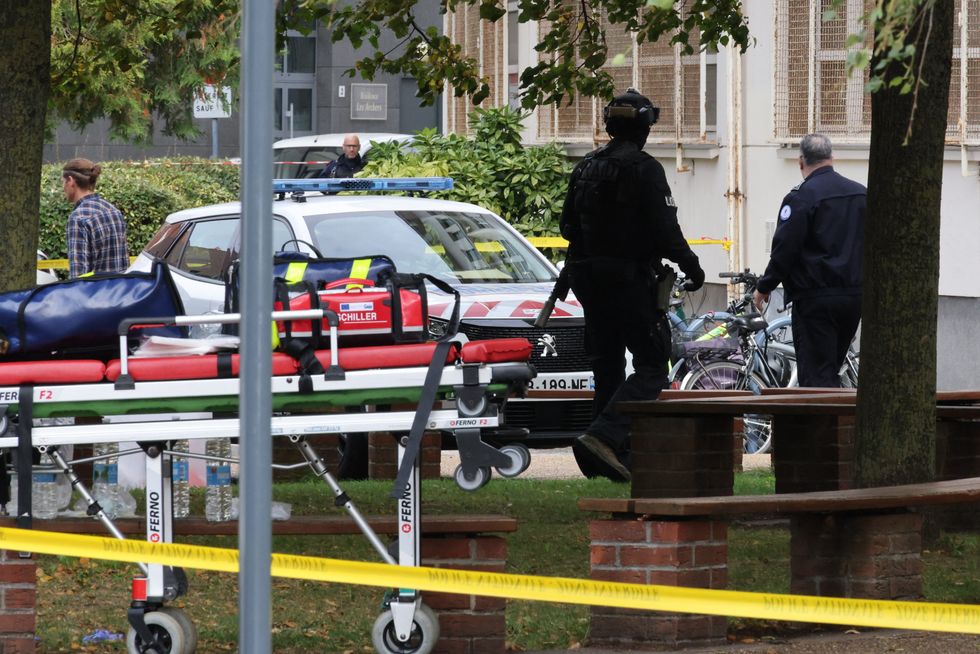 French police officers stand in front of the Gambetta high school in Arras