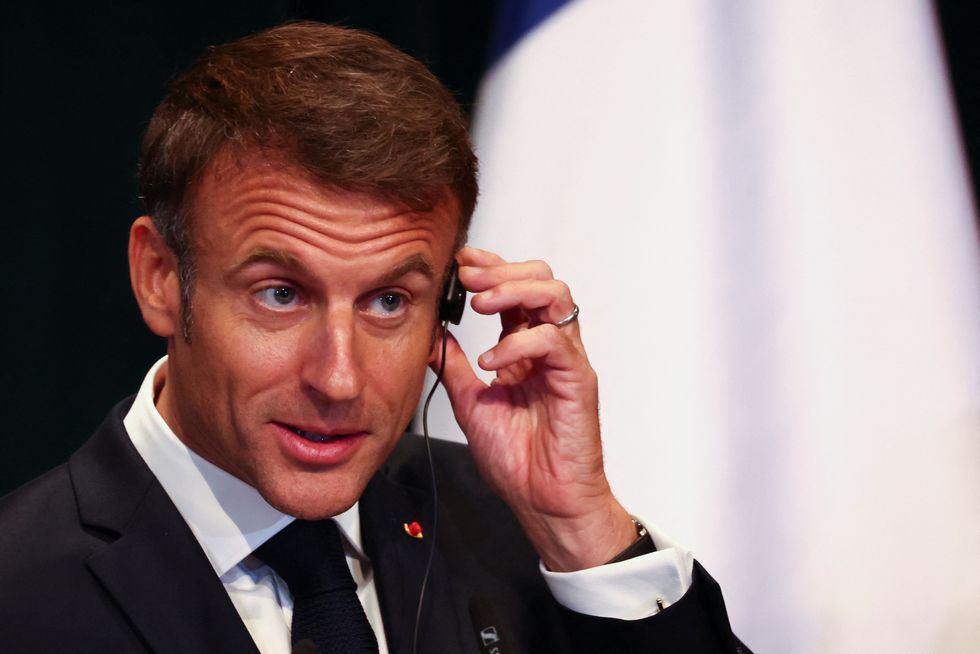 French President Emmanuel Macron attends a press conference in Tirana