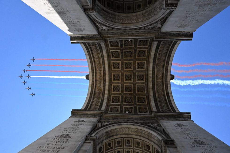French Red Arrows flying over Arc de Triomphe