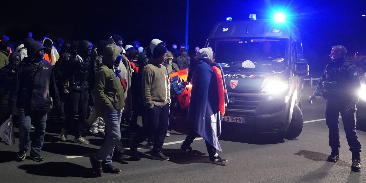 French riot police block dozens of migrants from reaching small boats in early hours confrontation