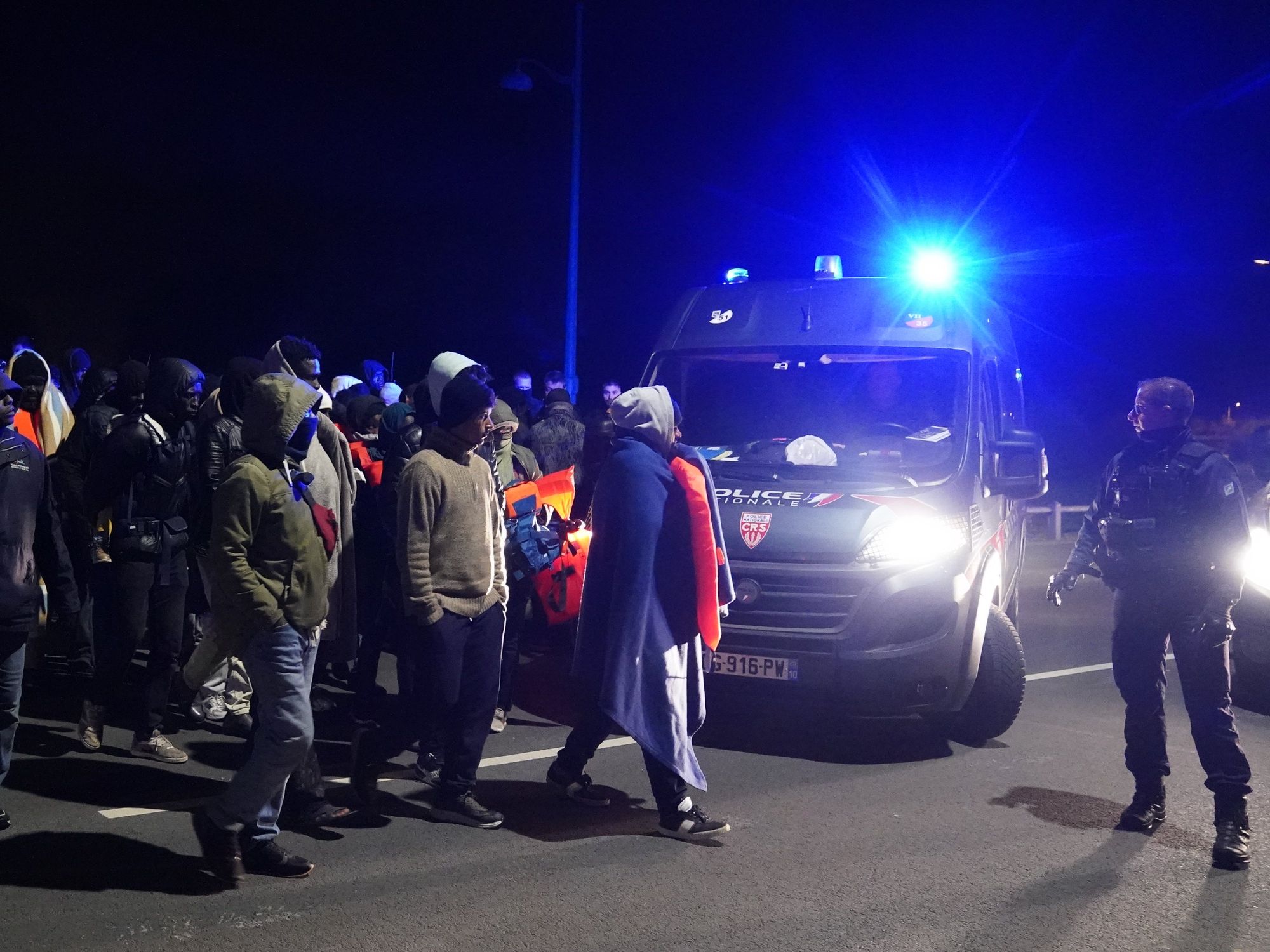 French riot police block dozens of migrants from reaching small boats in early hours confrontation
