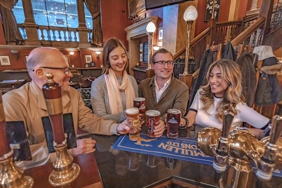 Friend drinking on London Small Group Tour of Historical Pubs