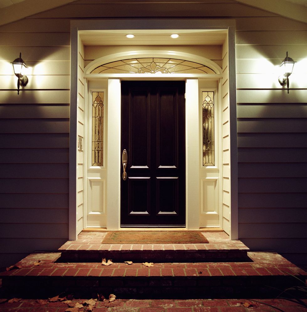 Front of house with porch lighting