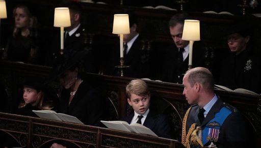 (front row, left to right) Princess Charlotte, the Princess of Wales, Prince George, and the Prince of Wales, watch as the Imperial State Crown and the Sovereign's orb and sceptre are removed from the coffin of Queen Elizabeth II, draped in the Royal Standard, during the Committal Service at St George's Chapel in Windsor Castle, Berkshire. Picture date: Monday September 19, 2022.